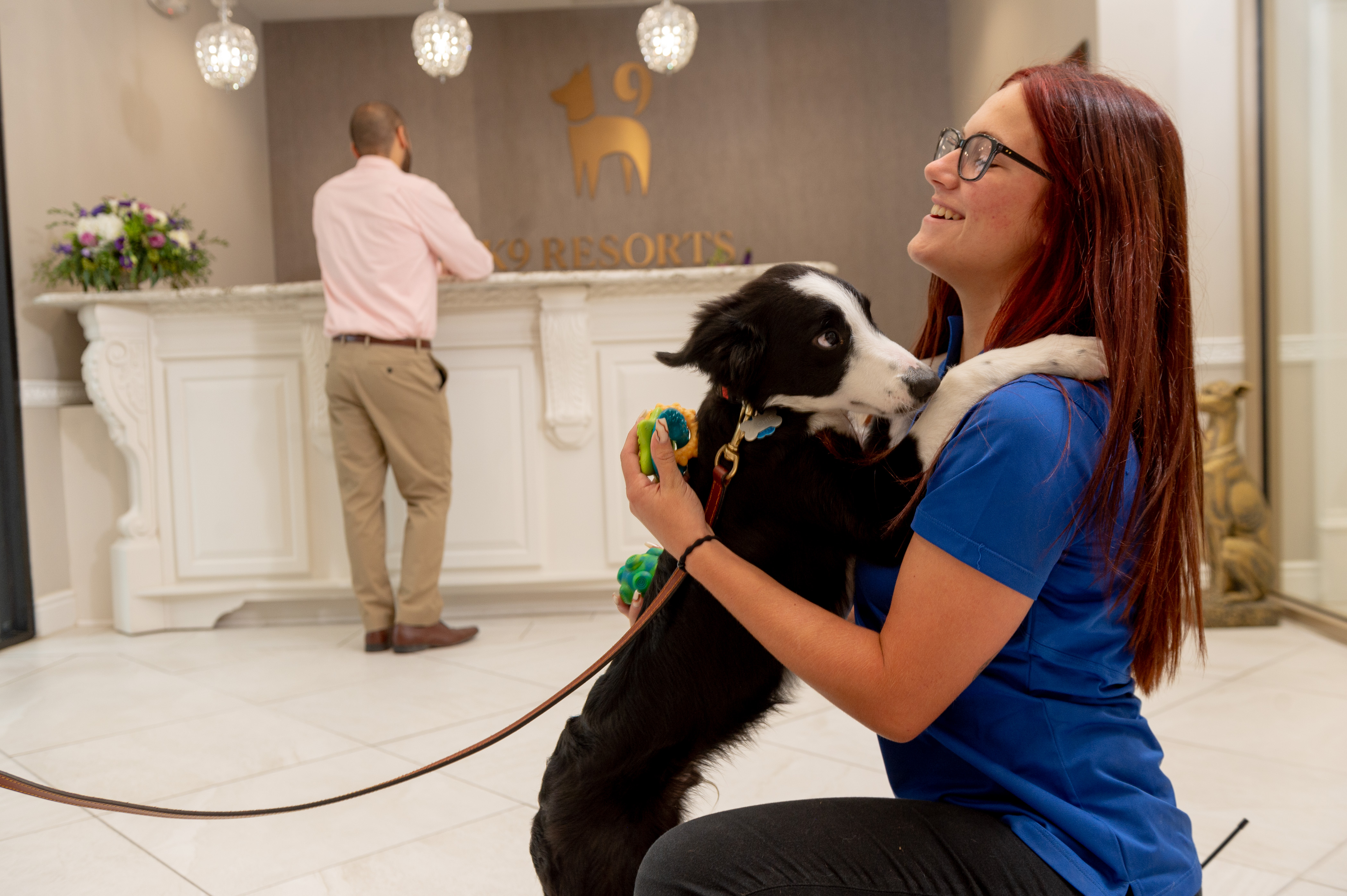 bethlehem-dog-care-professional-hugging-dog-in-lobby
